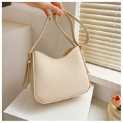 Minimalistisk crossbody-taske til kvinder i elegant vegansk læder
