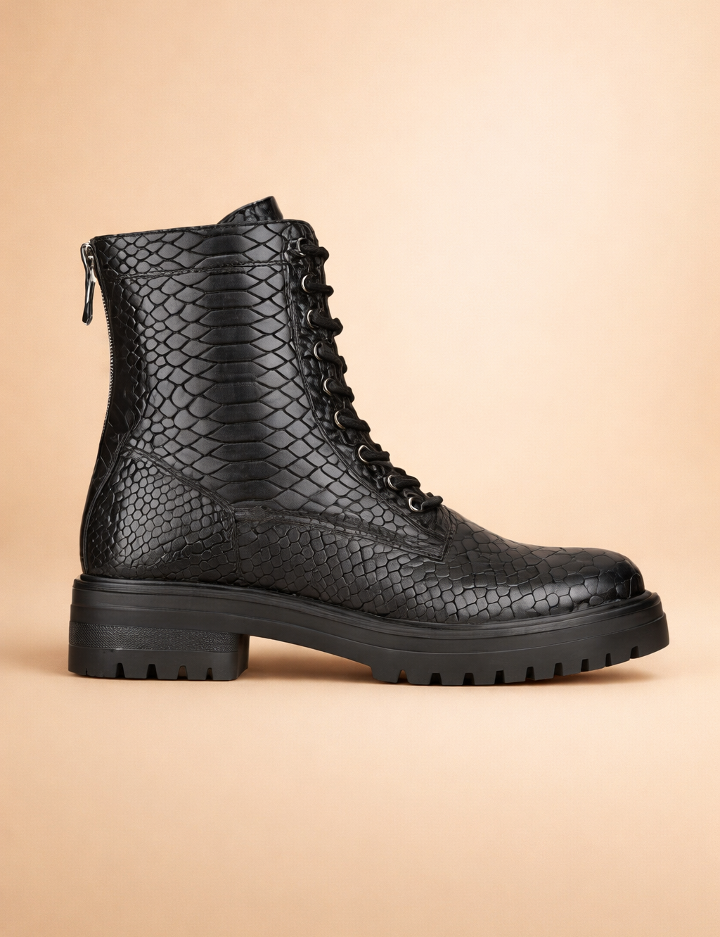 black-snake-embossed-combat-boots-side-profile-studio-pose.png