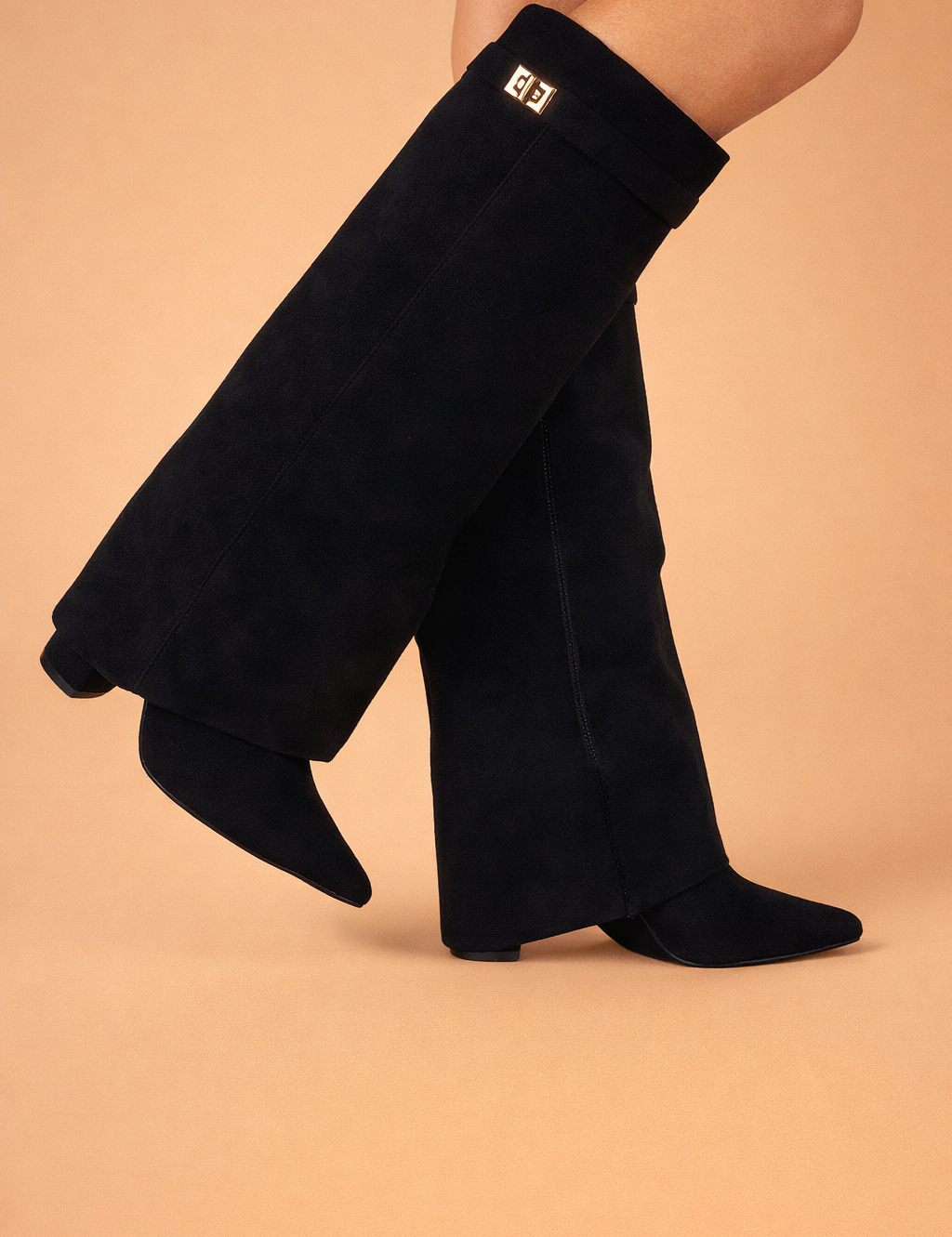 black-suede-knee-high-boots-side-walking-model-studio-shot.png