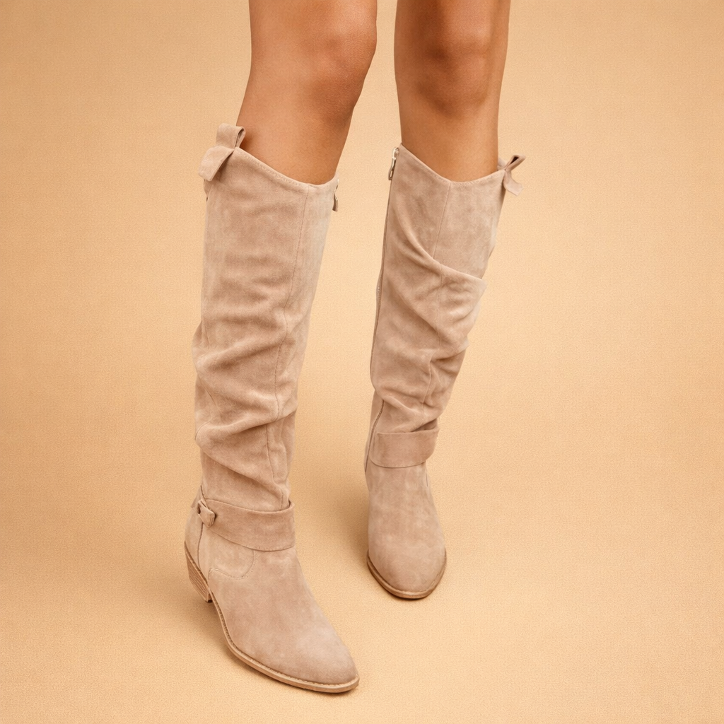 elegant-beige-knee-high-boots-woman-studio-pose-sand-background_0baa646d-5346-4c8d-aef9-99254c448583.png