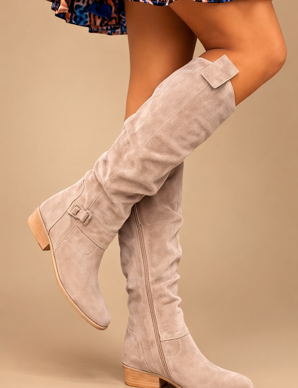 elegant-beige-knee-high-boots-woman-studio-pose-sand-background_2.png