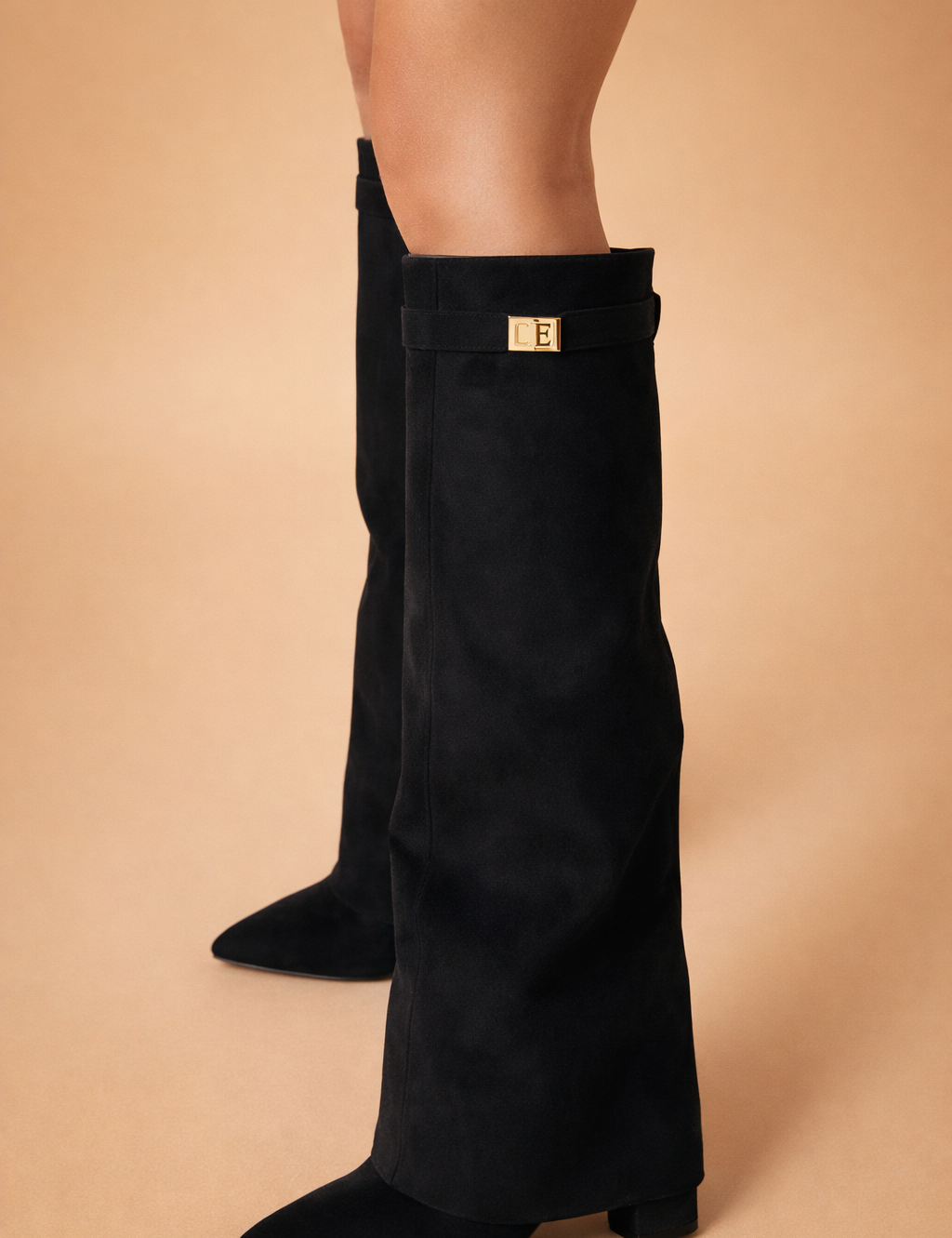 elegant-black-knee-high-boots-model-studio-side-pose.png