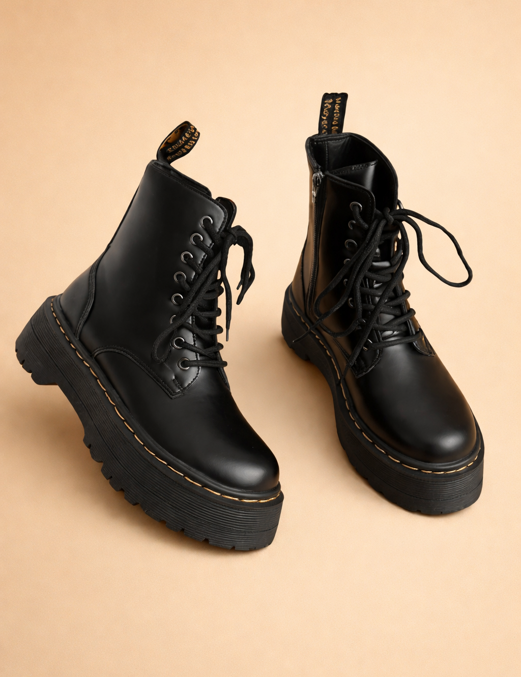 elegant-woman-wearing-black-platform-lace-up-ankle-boots-studio-pose.png