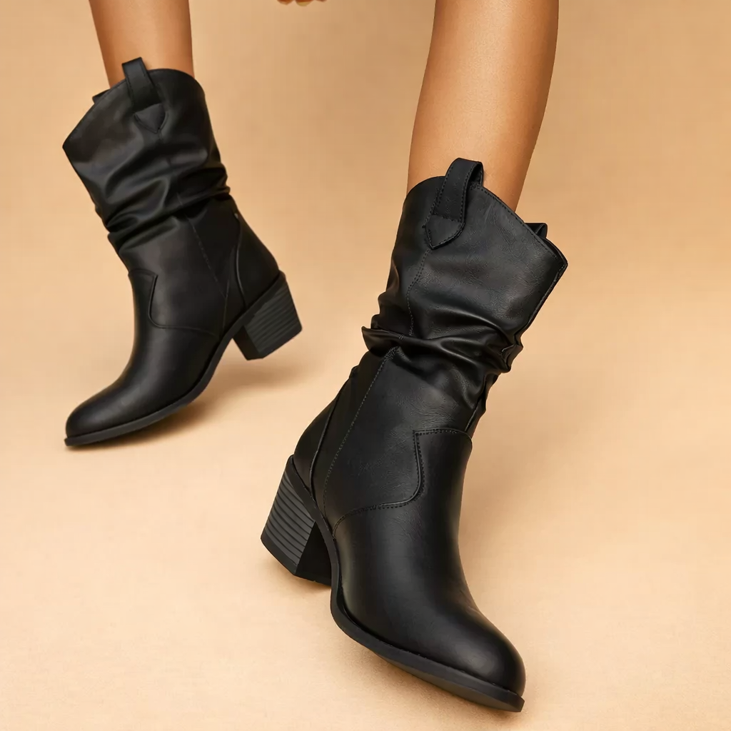european-model-walking-pose-black-slouch-ankle-boots-studio-shot.png