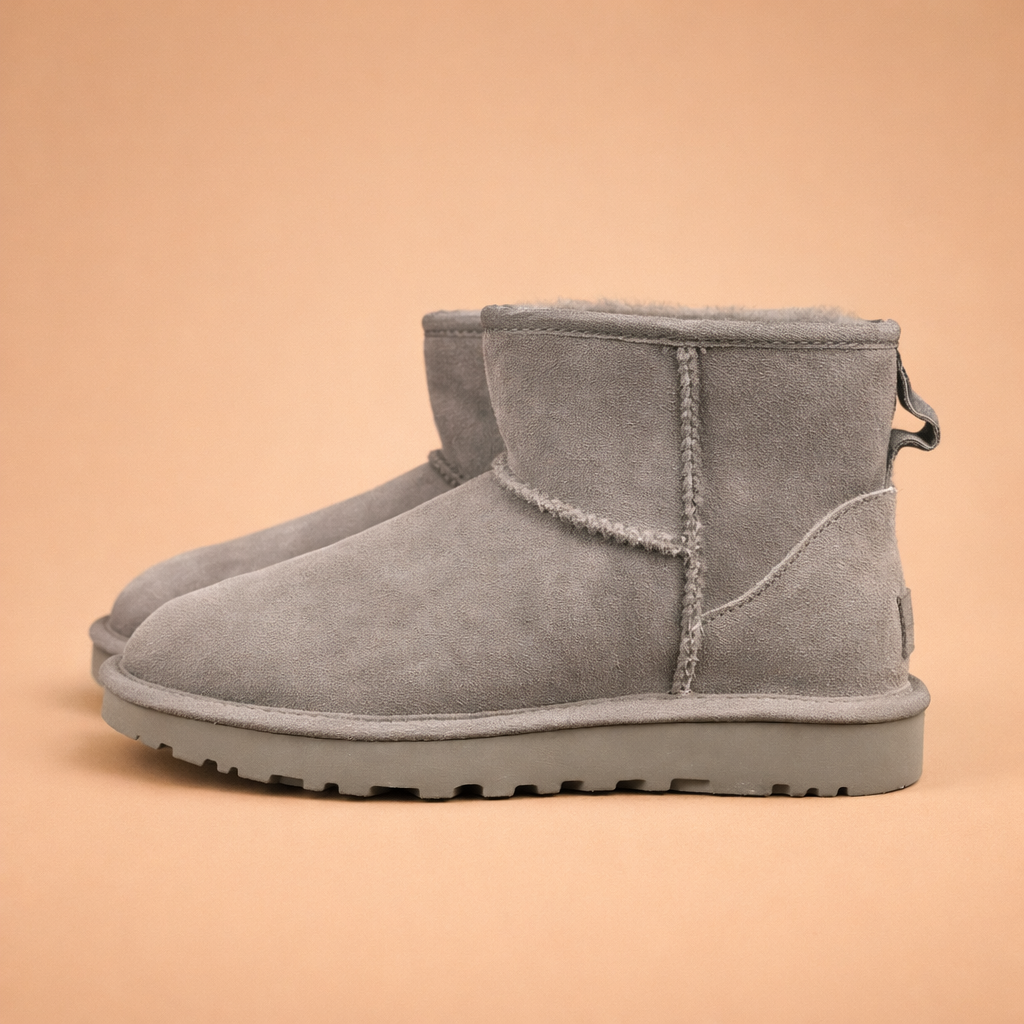 grey-suede-ankle-boots-women-studio-side-view-european-fashion-model-shot.png