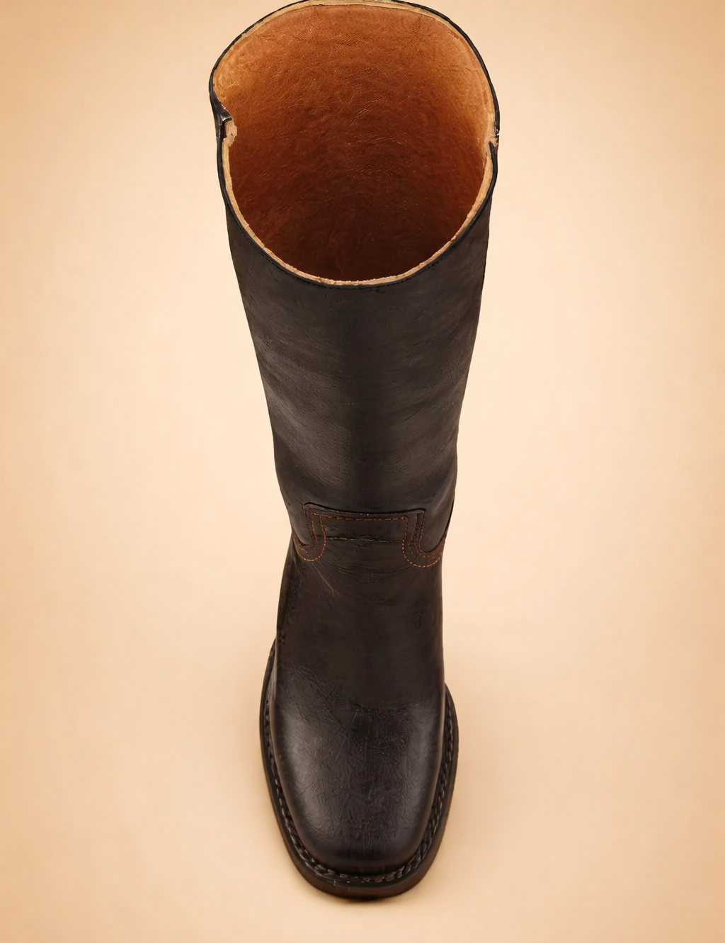 top-view-womens-dark-leather-tall-boot-european-studio-posed-product-shot.png